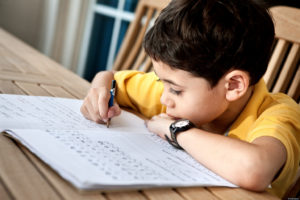 Young student receiving education from tuition