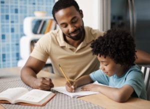Man tutoring a child in English and Maths